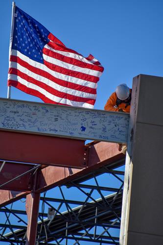 Worker installs the Signed beam